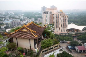 A privately-built illegal temple-like structure is seen on the top of a 20-storey residential block in the southern Chinese city of Shenzhen